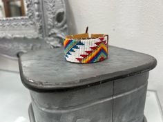 Southwestern Multicolor Adjustable Cuff Bracelet, Southwestern Multicolor Friendship Bracelets As Gift, Adjustable Multicolor Southwestern Cuff Bracelet, Adjustable Multicolor Jubilee Cuff Bracelet, Adjustable White Artisan Cuff Bracelet, Southwestern White Beaded Bracelets With Colorful Beads, White Southwestern Beaded Bracelets For Festivals, White Handwoven Bracelets With Round Beads, Bohemian White Cuff Bracelet With Round Beads