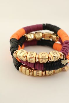 "There's no place like your alma mater. This fun color block polymer clay stretch bracelet is a must-have to show your love of the hokies. Offered in a gorgeous color block pattern, this easy-to-wear and stack bracelet will be a game-day favorite. Check out the shop page for the other schools available. Don't see your school? Reese's Hardwear accepts custom orders for schools and cities not currently in stock. Please send a message to inquire about a custom item. Listing is for one bracelet with Tech Bracelet, College Jewelry, Team Bracelets, Football Bracelet, College Colors, Stack Bracelet, Wire Wrapped Bangles, Color Block Pattern, Pave Beads