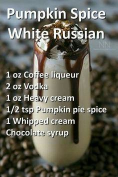 a cup filled with coffee and topped with whipped cream, chocolate syrup and white russian