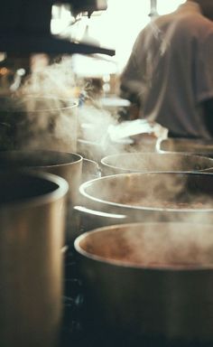 steaming pots and pans in a kitchen with steam coming out of the top one