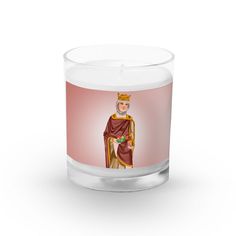 a glass candle with an image of a man in a crown on the front and side