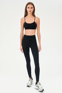 Our famous, form fitting high waist legging redesigned as a stirrup tight. Our ultra luxe Airweight fabric has a supremely soft hand and second skin comfort. BEST FOR: hot yoga, barre, Pilates. Model is 5'10" and wears a size small. Sleek Yoga Activewear With Built-in Bra, High Stretch Leggings With Built-in Bra For Yoga, Compressive Seamless Functional Tights, Compressive Functional Seamless Tights, Compressive Seamless Tights For Functional Use, Functional Seamless Micro-elastic Leggings, Functional Seamless Tight Tights, Sleek Fitted Sports Tights, Sleek Yoga Tights