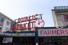 there is a sign that says public market and farmers market in front of the building