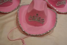 Light-Up Pink Cowgirl Hat with Sequin Lights up in different colors Made of felt pink-colored material Tiara glued in middle Each item may have small flaws due to handmade nature Shipping and Additional Info: Processing time: 0-3 weeks (due to international delays, may take longer) Tracking info emailed once product has shipped International buyers responsible for customs duties and VAT fees Not responsible for damages or lost packages after shipping No returns or refunds, all sales final Colors Fun Pink Hats For Country Events, Fun Pink Hat For Country Events, Cute Pink Party Hat, Fun Pink Brimmed Costume Hats And Headpieces, Pink Felt Hat With Curved Brim For Party, Pink Wide Brim Fun Hat, Pink Felt Hat With Curved Brim For Country Events, Pink Curved Brim Felt Hat For Country Events, Pink Fun Costume Cap