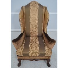 a brown and gold upholstered chair