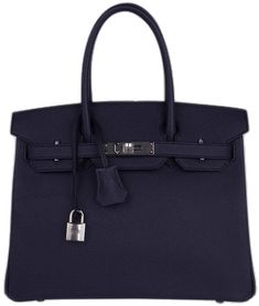 Luxury Blue Bag With Hasp Closure, Luxury Navy Bags With Gold-tone Hardware, Blue Everyday Bag With Lock, Blue Bags With Lock For Formal Occasions, Luxury Navy Shoulder Bag With Gold-tone Hardware, Blue Office Bag With Hasp Closure, Luxury Satchel With Hasp Closure For Shopping, Elegant Tote Bag With Lock, Luxury Navy Rectangular Satchel