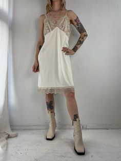 - Vintage 90s cream white slip dress - 100% nylon - Lace at bust and hem  - Made in USA  - Brand: Vam Roalte - Medium  Bust: 18" Length: 38" We are not responsible for lost, stolen, or damaged packages once they have been shipped. Any additional customs duties or taxes incurred on international orders are the responsibility of the buyer. Please note that our items are vintage and may have minor flaws or imperfections due to their age, which adds to their unique character. Vintage V-neck Slip Dress For Spring, Sleeveless Bias-cut Beige Slip Dress, Sleeveless Beige Slip Dress Bias Cut, Sleeveless Bias Cut Beige Slip Dress, White Sheer Slip Dress For Summer, White Sheer V-neck Slip Dress, Fitted Beige Slip Dress With Lace Trim, Beige Slip Dress With Lace Trim For Daywear, Fitted Beige Lace Trim Slip Dress