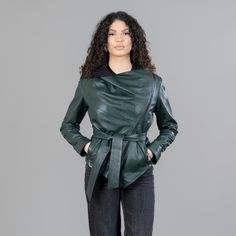 Green leather jacket with a belt and a hood. This jacket has exterior side pockets, a hood, a removable belt, and a side zipper closure. Furthermore, the green leather jacket with a belt will stand out with its pattern and warmth. The jacket manufactures in our company in Greece with high-quality leather. Leather: Yes Color: Green Length: 50-55 cm (19,6-21,6 in) Hood: Yes Exterior pockets: Yes Belt: Yes Lining: 100% Polyester Care: Specialist clean Hooded Leather Outerwear For Work, Leather Jacket With Belted Cuffs, Winter Workwear Outerwear With Storm Flap, Green Outerwear With Belted Cuffs And Long Sleeves, Green Long Sleeve Outerwear With Belted Cuffs, Winter Green Belted Outerwear, Hooded Belted Fall Outerwear, Hooded Belted Outerwear For Fall, Belted Hooded Outerwear For Fall