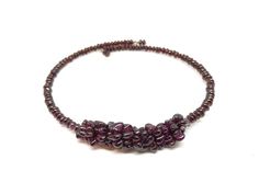 Irregular garnet beads are strung on flexible jewelry wire with no clasp to close. Simply wrap it around your neck and you are ready to go. This beaded choker present just great! Very unique and simple looking piece that everyone will notice. Imagine wearing this choker against white shirt... Just perfect. LENGTH: 15 in (38 cm) -------------------------------------------------------------- PACKING: All my jewellery will come to you packed securely and presented as a gift ready to give or keep fo Choker Beads, Red Gemstone Necklace, Gemstone Choker Necklace, Gemstone Choker, Garnet Necklace, Garnet Jewelry, Red Gemstones, Jewelry Wire, Necklace Gemstone