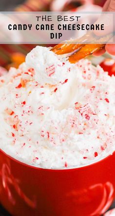 the best candy cane cheesecake dip is in a red bowl and ready to be eaten