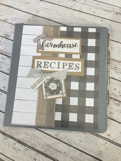 a recipe book sitting on top of a wooden table