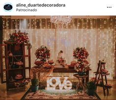 an image of a table with flowers on it and lights in the room behind it