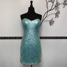 This Short Dress Features Beautiful Sequins, Embellished With Jewels, And Back Zipper Closure. Embellished Light Blue Prom Dress, Fitted Light Blue Sequin Evening Dress, Glamorous Light Blue Sequined Dress, Blue Fitted Sequin Dress With Sweetheart Neckline, Embellished Light Blue Dress For Prom Season, Light Blue Sequin Dress For Night Out, Light Blue Sequin Cocktail Dress, Light Blue Embellished Fitted Dress, Blue Embellished Mini Dress For Homecoming