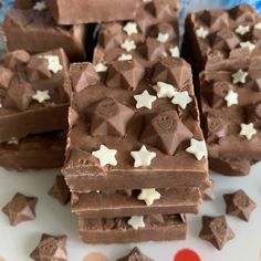 several pieces of chocolate with white stars on them