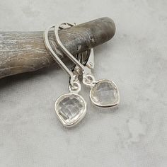 "Enticing little clear crystal quartz hearts swing from sterling silver leverback earrings. Small and lightweight - great for someone who doesn't love big jewelry. The April birthstone is diamond. The petite clear quartz stones are 10x7mm in size and are created from hydrothermal quartz. Total drop length of the earring is about 1\" long (2.54 cm). Sterling silver leverback earrings. Items are shown larger in pictures to show detail - please note the dimensions. Jewelry is packaged in a blue cot Blue Sapphire Necklace, Big Jewelry, April Birthstone, Leverback Earrings, Clear Quartz Crystal, Crystal Quartz, Star Necklace, Quartz Stone, Heart Earrings