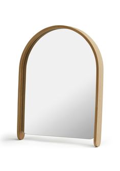 an arch shaped mirror is shown against a white background