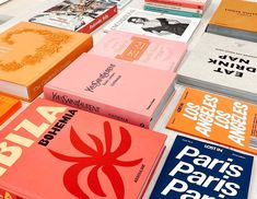 many books are stacked on top of each other in different colors and sizes, with the title paris pars paris part written above them