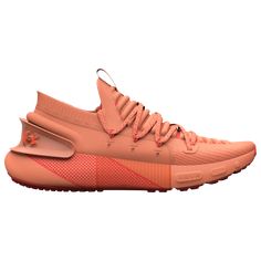 a pair of orange sneakers on a white background