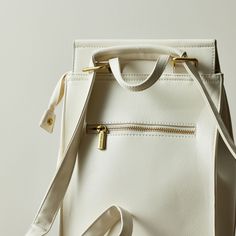 This convertible backpack is perfect for on-the-go fashionistas. The stylish and versatile design can be easily converted from a backpack to a mini bag, making it the perfect choice for any occasion. The coconut cream color is perfect for summer. Color: Coconut Cream Size: L 10.25” x H 13” x D 5.25" Material: Made with 100% vegan leather Origin: Imported The actual color of this product may vary slightly under different lighting conditions. Childrens Shop, Convertible Backpack, Cool Notebooks, Melting Candles, Summer Color, Camping Accessories, Crossbody Tote, Wallet Accessories, Bar Accessories