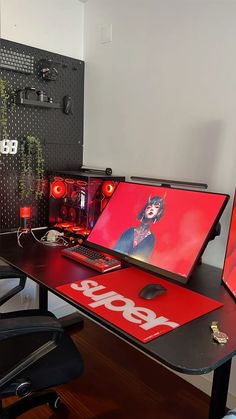 a laptop computer sitting on top of a desk next to a red sign that says sale