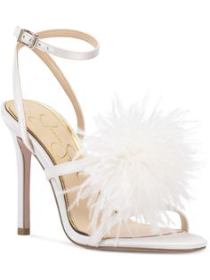 a white high heeled sandal with feathers