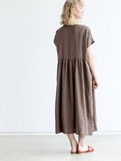 "Handcrafted Oeko-Tex Standard certified 100% European linen smock dress ideal for everyday wear. Perfect for springtime or chilly summer days. Always dress to kill! Neckline: round Silhouette: shift Length: ±48\"/120cm (we can make adjustments) Sleeve length: short Pockets: side seam Details: *Colour shown: moss green/ wood brown/ blue *Model is wearing size M *Medium weight *Maternity-friendly *Relaxed fit *Not-ironed (and no need to) *Handmade by @LinenCloud Easy care: - Machine wash gentle - Casual Brown Linen Maxi Dress, Casual Flax Color Relaxed Fit Dress, Brown Linen Dress For The Beach, Casual Brown Linen Dress With Relaxed Fit, Linen Lagenlook Maxi Dress With Relaxed Fit, Lagenlook Linen Maxi Dress With Relaxed Fit, Oversized Linen Maxi Dress In Casual Style, Oversized Linen Casual Maxi Dress, Oversized Linen Maxi Dress Casual Style