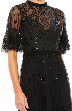 The little black dress is always an excellent choice, and this one adds sparkle and frill to prove the point. 34 1/2" length Jewel neck Short sleeves Partially lined 100% polyester Spot clean Imported Asian Owned/Founded Cute Hoco Dresses, Black Mac, Junior Party Dresses, Special Dress, Plastic Dress, High Neck Mini Dress, Unique Prom Dresses, Create Memories, Short Homecoming Dress