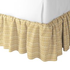 the bed skirt is made with yellow and white checkered fabric