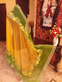 This lehenga is made in dupion silk with full handwork thread embroidery. The dupatta of this outfit has 2 options, one with Single color with single border embroidery( as on model) and Second option with double colour with 2 Borders of embroidery (as on dummy). Luxury Raw Silk Dupatta With Multicolor Embroidery, Luxury Dupatta With Intricate Multicolor Embroidery, Luxury Multicolor Dupatta With Dori Work, Luxury Multicolor Dupatta With Motifs, Luxury Embroidered Dupatta With Multicolor Embroidery, Luxury Multicolor Embroidered Dupatta For Traditional Ceremonies, Luxury Multicolor Cutdana Dupatta, Luxury Embroidered Dupatta For Traditional Ceremonies, Embroidered Green Dupatta