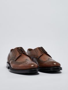 Upper: 100% Calf leather Sole: 100% Rubber Timeless Leather Shoes With Leather Sole For Derby, Timeless Leather Derby Shoes With Leather Sole, Brown Luxury Lace-up Shoes With Plain Toe, Semi-formal Lace-up Shoes With Rubber Sole And Calf Leather, Derby Oxfords With Branded Insole And Calf Leather, Calf Leather Oxfords With Branded Insole For Derby, Timeless Brogue Leather Shoes With Round Toe, Timeless Leather Shoes With Brogue Detailing And Round Toe, Timeless Calf Leather Lace-up Shoes With Brogue Detailing