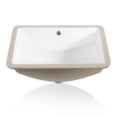 a white bathroom sink sitting on top of a counter next to a faucet