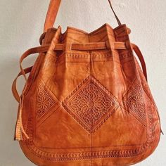 An amazing tan leather boho bag is the best addition to your bohemians bags collection.A stunning piece from our dazzling collection of authentic and stylish Leather crossbody hippie bags crafted in Marrakesh. Handmade and carved, functional, and perfect for office or weekends .Leather with a Boho pattern enhances the rich textural quality of a small bohemian bag crafted from soft leather . - 100% leather- 100% handmade- Long durabilityDimensions : 36 × 34 × 10 cm (H * L * W)Shipping & Delivery Bohemian Brown Shoulder Bag For Festival, Bohemian Brown Shoulder Bag, Brown Artisan Shoulder Bag For Festivals, Artisan Leather Shoulder Bag For Festival, Handmade Bohemian Leather Shoulder Bag, Bohemian Crossbody Shoulder Bag With Leather Lining, Hippie Handmade Brown Shoulder Bag, Bohemian Soft Leather Crossbody Bag, Hippie Brown Handmade Shoulder Bag