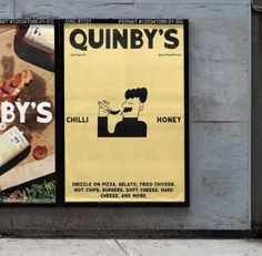 an advertisement for quibbly's pizza on the side of a building in new york city