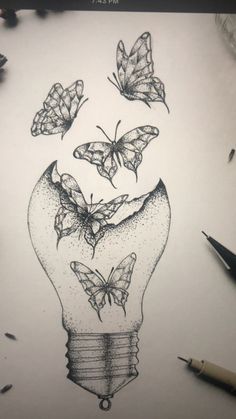 a drawing of a light bulb with butterflies flying out of it and on top of it