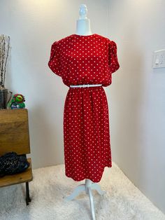 1980s Dress / 80s dress / 1980s polka dot dress / 1980s does 1950s / 1980s fashion / 80s fashion / 80s style / vintage dress This dress is from the 1980s and is the more comfortable version of the classic 1950s style. She has a colorful white polka dot print on a vibrant red. This dress would be perfect for a day dress or you can dress her up for and event. She is versatile! She has an elastic waist band to make her super comfortable and a full skirt. She slips over the head, gas built in shoulder pads, and has a button  at the back of the neck. Measurements provided are flat and have been doubled. modern size large Bust 44" Waist 30"-35"   Hips 48" Length 45" ❤️ Condition: Excellent vintage condition. Flaw : none. Belt not included. $148  includes domestic shipping and insurance. Internat Spring Polka Dot Vintage Dress, 1950s Style Polka Dot Dresses For Spring, Polka Dot Dresses For Vintage Fashion, Vintage Fashion Polka Dot Dresses, Retro Polka Dot Dress For Work, Summer Vintage Fashion Polka Dot Dress, Retro Polka Dot Workwear Dresses, Vintage Polka Dot Summer Dresses, Polka Dot Midi Length Daywear Dress