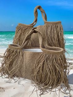 👜Crochet raffia tote bag is completely hand knitted natural paper rope raffia. 🏖️Our multipurpose bags are suitable for daily use such as beach and shopping.  Thanks to the pocket on the lining of the product, you will be able to organize your beach bag by placing your sun creams, wet and dry swimsuits, keys, wallet, glasses, etc.  You can also use it multipurpose for your other needs. It is a useful product that you can easily fit all kinds of things you may need on the beach.  👜The product Raffia Tote Bag, Summer Tote Bag, Crochet Beach Bags, Summer Tote Bags, Crochet Fringe, Straw Beach Bag, Multipurpose Bag, Summer Tote, Fringe Bags