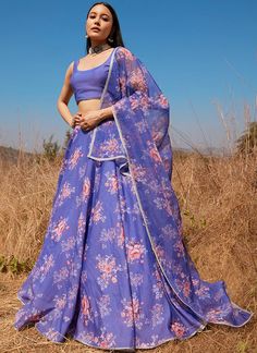 Ditch gaudy embroideries and over the top detailing and go for an easy, breezy and flowy formal ensemble by choosing our Periwinkle Floral Chanderi Lehenga. The short sleeveless chanderi silk choli has been kept very simple and plain so that the printed chanderi lehenga is the centerpiece in this outfit. The lehenga is Bohemian Anarkali Set For Summer Wedding, Summer Embroidered Anarkali Set In Georgette, Summer Georgette Sets With Sheer Dupatta, Summer Sets With Sheer Dupatta In Georgette, Summer Organza Sharara With Sheer Dupatta, Summer Festive Organza Anarkali Set, Summer Festive Organza Palazzo Set, Bollywood Style Organza Sharara For Summer, Bollywood Style Summer Organza Sharara