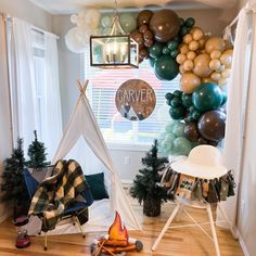 a room filled with balloons and furniture next to a window