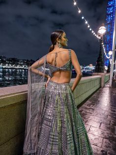 This lehenga set features antique silver sequin embroidery in a geometric pattern. The blouse shows crystal tassels at the waist. Embroidered dupatta also shows crystal tassels. The outfit can be paired with (an optional) antique gold cape jacket with matching embroidery. The jacket has heavy beaded tassels.From Seema Gujral's For the love of London collection. DELIVERY TIMEPlease allow 8-12 weeks for your outfit to arrive. FABRIC DETAILSNet Professional cleaning only. Sequin Lehenga, Tassel Embroidery, Matching Embroidery, Cape Jacket, Sequin Embroidery, Embroidered Dupatta, Sequins Embroidery, 12 Weeks, Silver Sequin