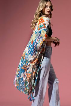 Discover the epitome of style in our trendsetting kimono - A seamless blend of gentle texture, enriched with beautiful leopard and ethnic patterns. Embrace the allure of the unique mix and let the colorful tassels add a playful touch. This gorgeous piece, with its special texture, adds a special dimension to your collection. It's not just great, it's exceptional - a stunning testament to your unique style. 100% Viscose *APPROX. L 38" W 40" Multicolor Vacation Kaftan With Tassels, Multicolor Tasseled Kaftan For Vacation, Multicolor Tassel Kaftan For Vacation, Spring Multicolor Kaftan With Tassels, Bohemian Patterned Kimono With Vibrant Print, Bohemian Long Kimono With Vibrant Print, Fall Beach Kimono With Tassels, One Size Multicolor Boho Print Kimono, Long Bohemian Kimono With Vibrant Print