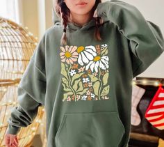 Vintage Flowers Hoodie, Boho Wildflowers Hoodie,Watercolor Floral Hoodie,Wildflowers Floral Hoodie,Meadow Flowers Hoodie,Summer Fall Flowers   PRODUCT DETAILS 💫Youth Hoodies do not have drawcord for added safety💫 - Our hoodies are made for comfort with a 50% cotton and 50% polyester blend. - They're built to last with a medium-heavy fabric  (8.0 oz/yd² (271 g/m - Enjoy a relaxed fit and a sewn-in label. - Get the right size with our true-to-size guide.   SIZING - Find your perfect fit in our s Green Relaxed Fit Hoodie For Spring, Green Hooded Hoodie For Spring, Green Spring Hoodie With Drawstring Hood, Green Hoodie With Drawstring For Spring, Green Hoodie For Spring, Green Hoodie Sweatshirt For Spring, Green Casual Spring Hoodie, Digital Wardrobe, Painting Hoodie