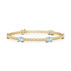 Stack it or wear it solo, this five stone station link bracelet is sure to grab attention. It is designed in 14k yellow gold and features oval sea-blue aquamarines that are horizontally aligned. Tanzanite Bracelet, Gold For Women, April Birthstone Jewelry, Aquamarine Bracelet, March Birthstone Jewelry, Anniversary Jewelry, March Birthstone, Natural Aquamarine, March Birth Stone