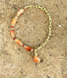 "This Necklace features Beautiful Carnelian Tube Gemstones in a Half and Half Short Necklace, an  18K Gold Plated Tubular Chain with a  Carnelian Stone Pendant.   This is a Unique Short Necklace. Enjoy  - Handcrafted in the USA - 18K Gold Plated Tubular Chain, and golden elements -  - Length 17.5\" + 1\" extension chain approx." Half And Half, Carnelian Stone, Wire Bracelet, Short Necklace, Stone Pendant, Gold Filled Chain, Fort Lauderdale, Stone Pendants, Chain Styles