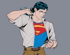 a man in glasses and a superman shirt is holding his hands behind his head while looking down