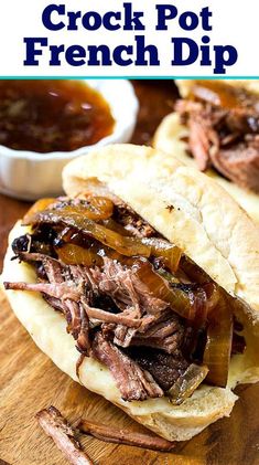 the crock pot french dip sandwich has been cut in half and is ready to be eaten