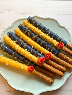 there are many different types of food on the platter, including pretzels and crackers