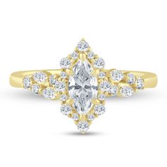 a yellow gold engagement ring with an oval cut diamond surrounded by smaller round brilliant diamonds