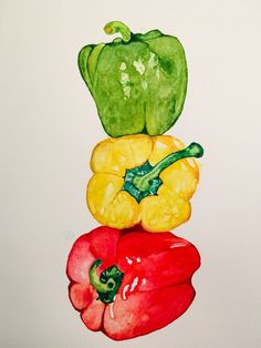 three peppers are stacked on top of each other in the shape of a stack with one green pepper and two yellow peppers