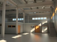 an empty building with stairs and windows