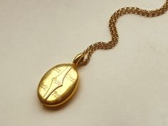 This is a beautiful, finely made , buttery 18 K gold locket with interesting inscriptions. On one side it says 22nd February 1902 (which is one year after Queen Victoria died, so the start of the Edwardian period), and on the other side it says in the center Nurse, then each quadrant is engraved From Christine ,Philip , & Faith. Apparently it is a locket given as a gift to the governess or nurse whose charges these 3 children were. It opens to reveal two glass compartments which fold out . I Gold Medallion Locket Necklace Stamped 14k, Gold Heirloom Brass Locket Necklace, Heirloom Gold Brass Locket Necklace, Vintage 22k Gold Engraved Jewelry, Yellow Gold Oval Pendant Locket Necklace, Luxury Yellow Gold Oval Locket Necklace, Antique 22k Gold Engraved Jewelry, Antique Engraved 22k Gold Jewelry, Elegant Hallmarked Locket Necklace For Formal Occasions